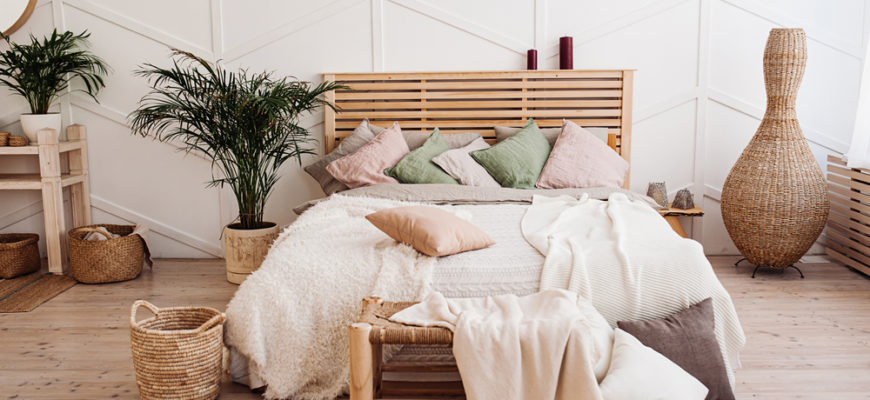 Very,Cozy,Wooden,Bed,With,A,Bedspread,Of,Pastel,Colors,