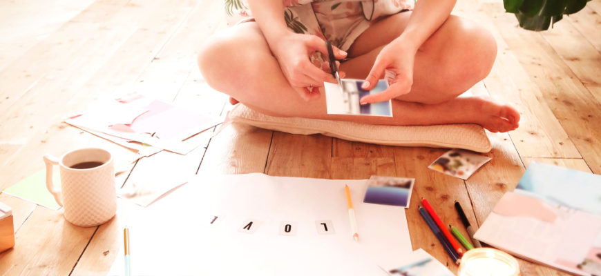 Young,Woman,Creating,Her,Feng,Shui,Wish,Map,Using,Scissors.