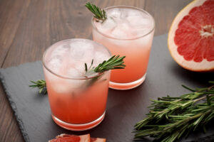 Refreshment,Grapefruit,Cocktail,With,Rosemary,On,Slate,Board.,Healthy,Citrus