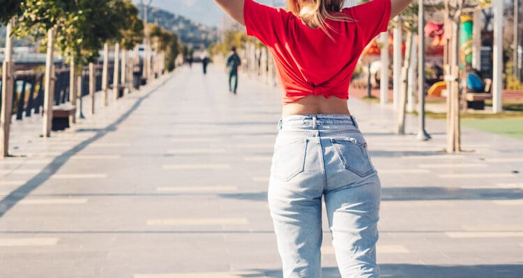 Young,Pretty,Woman,Riding,On,The,Roller,Skates,In,The